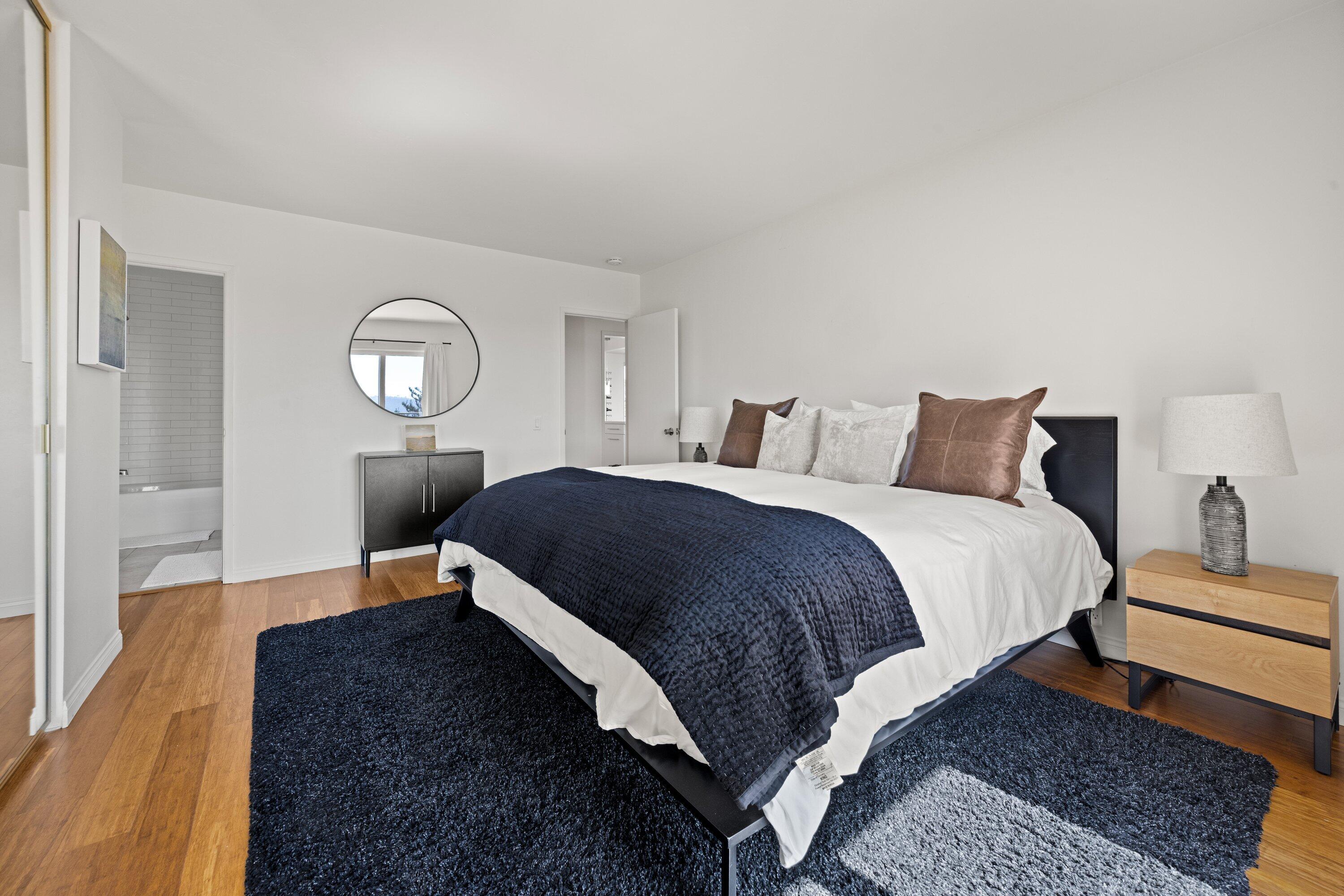 128 Las Alturas Road Santa Barbara, CA 93103 - Photo 16 of 34 a bed room with a bed mirror and a window