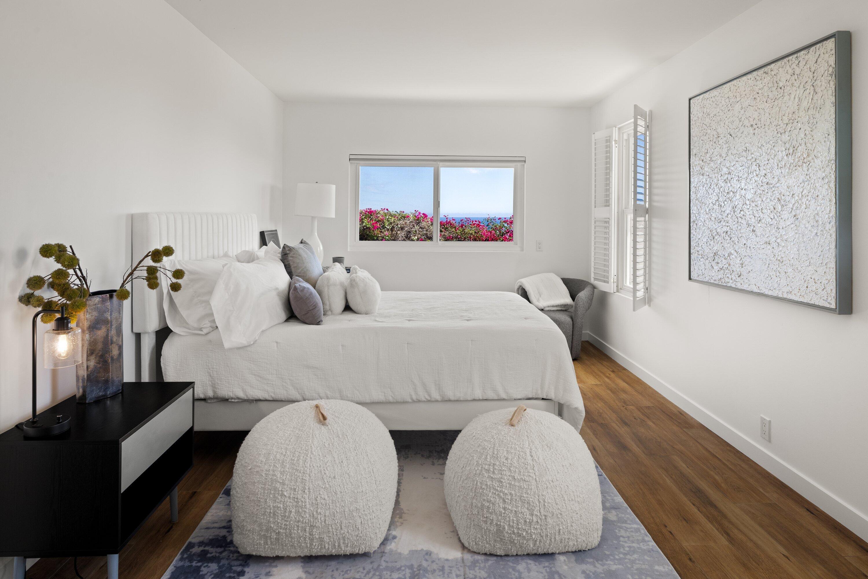 128 Las Alturas Road Santa Barbara, CA 93103 - Photo 21 of 34 a bedroom with bed and glass window