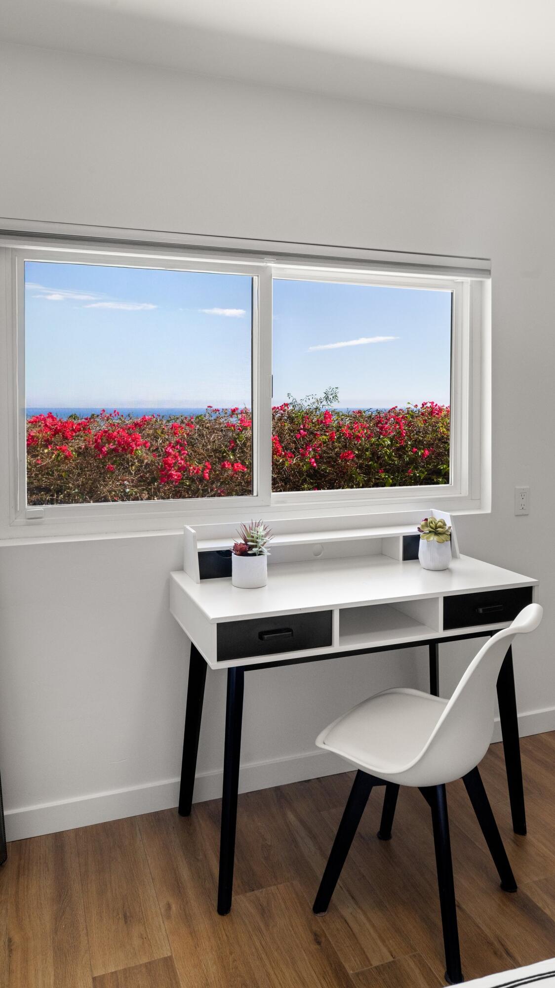 128 Las Alturas Road Santa Barbara, CA 93103 - Photo 25 of 34 a room with a table and a painting on the wall