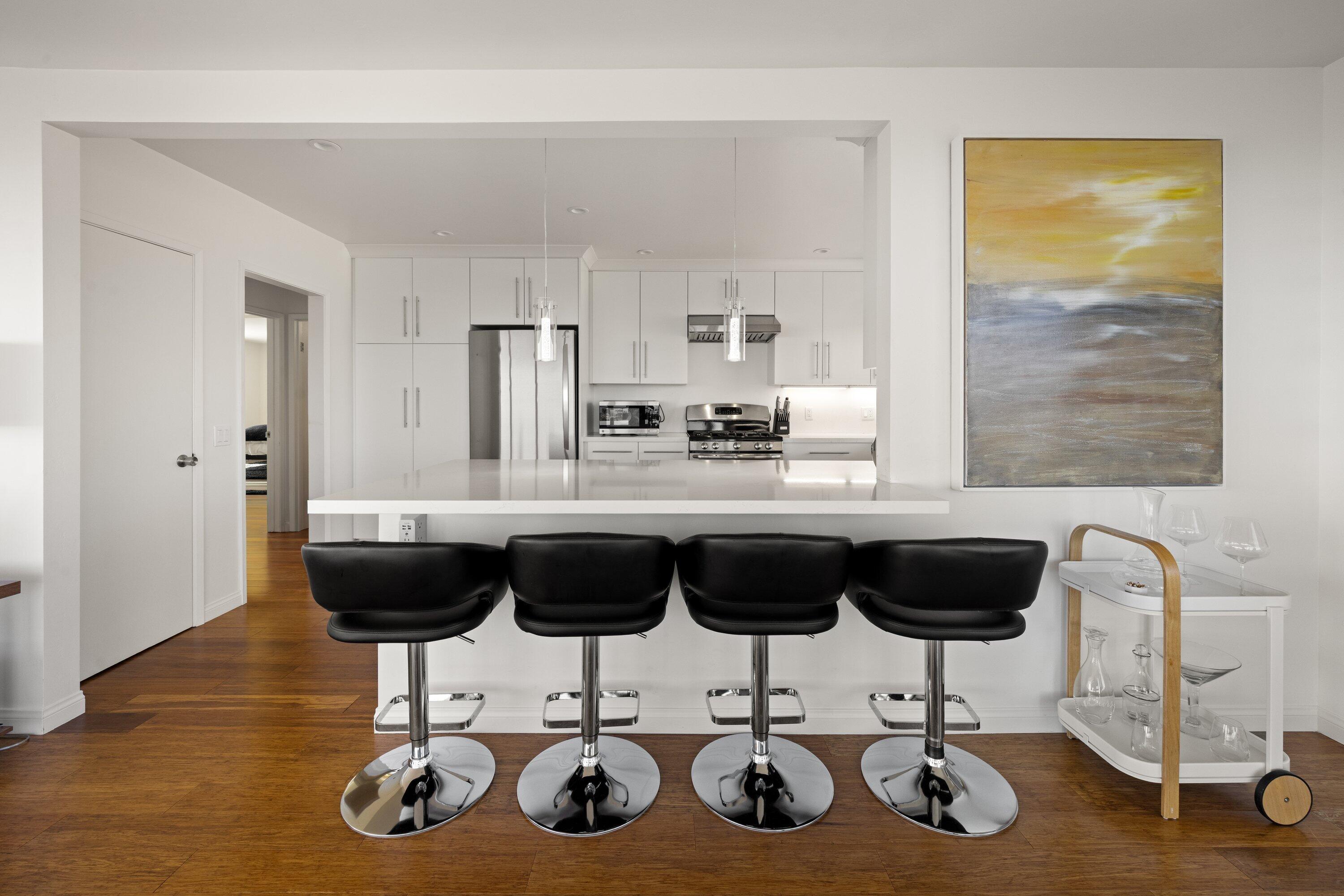 128 Las Alturas Road Santa Barbara, CA 93103 - Photo 4 of 34 a kitchen with a table chairs and kitchen view