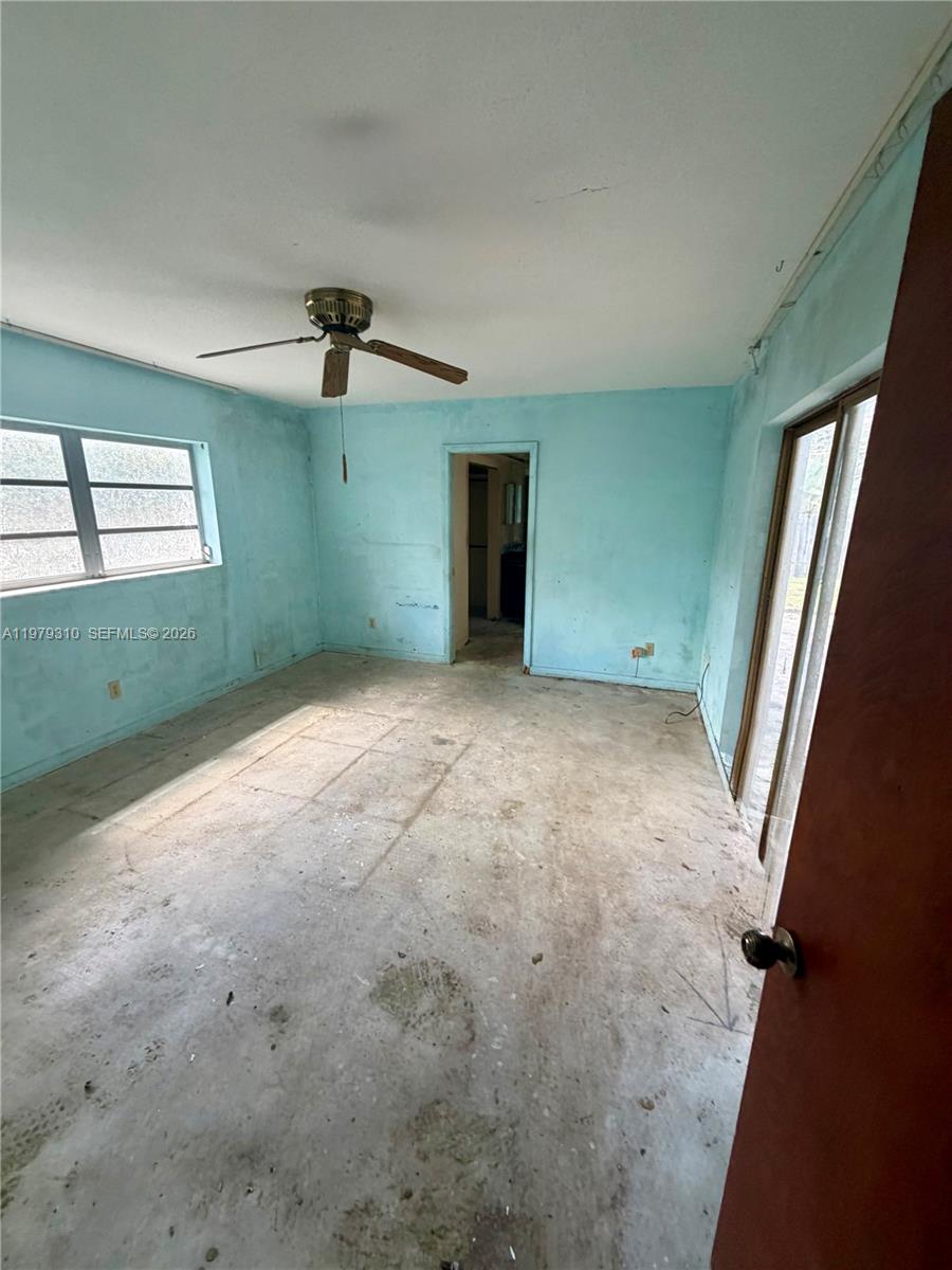 1761 Southwest 55th Avenue Plantation, FL 33317 - Photo 11 of 18 en empty room with windows and fan