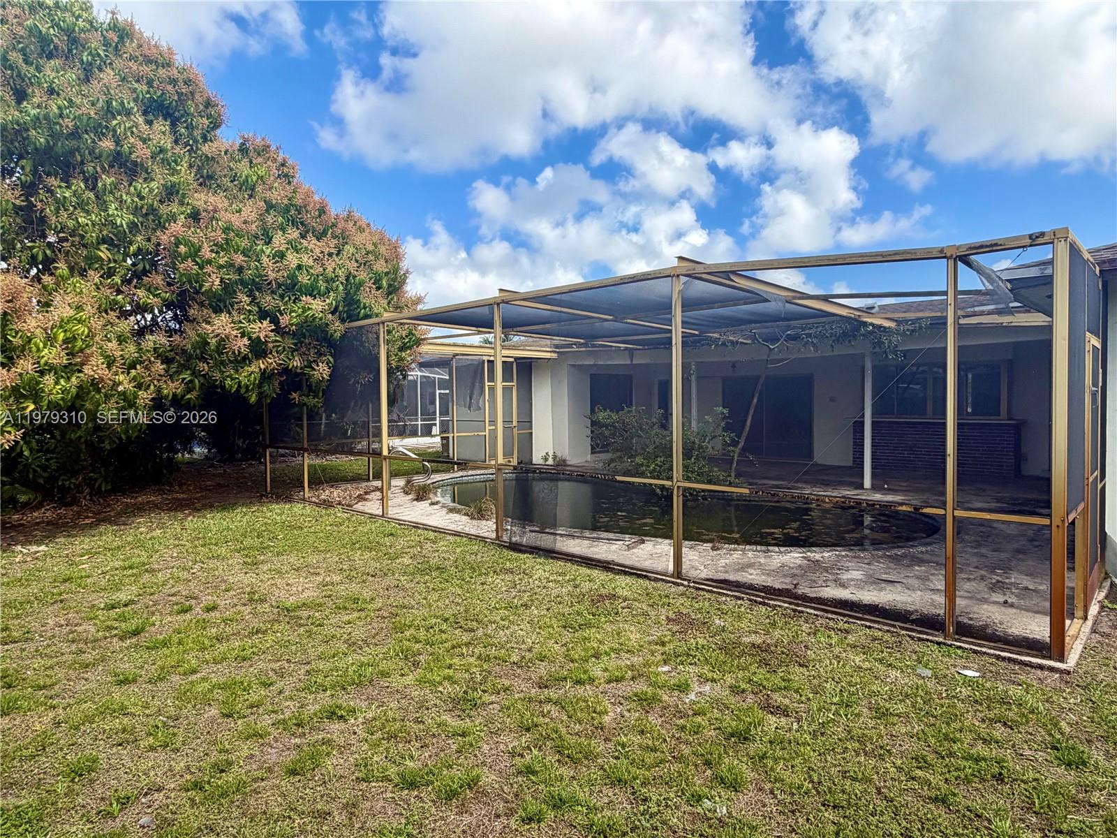 1761 Southwest 55th Avenue Plantation, FL 33317 - Photo 4 of 18 a view of a house with backyard and sitting area