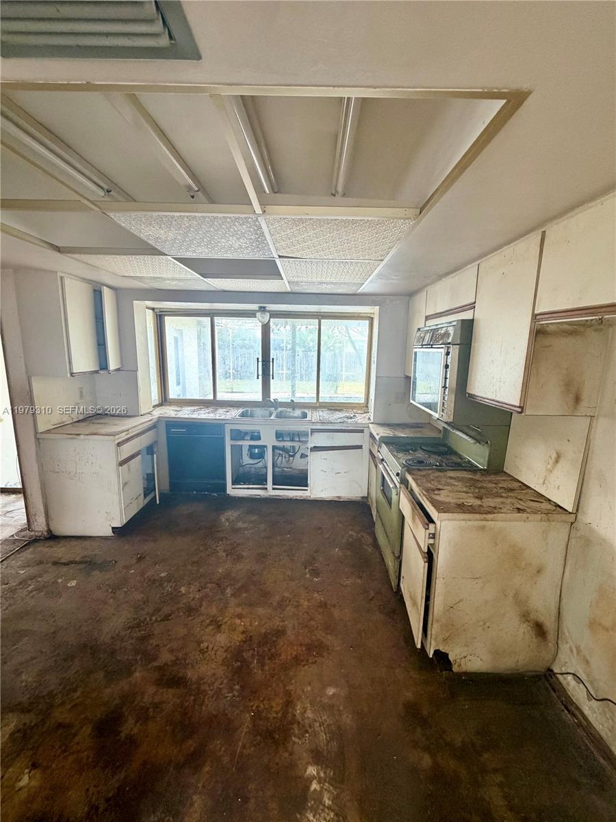 1761 Southwest 55th Avenue Plantation, FL 33317 - Photo 8 of 18 a view of an empty room with a window