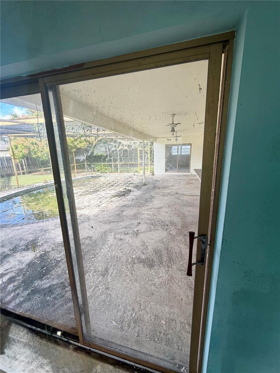1761 Southwest 55th Avenue Plantation, FL 33317 - Photo 9 of 18 a view of empty room with wooden floor and front door