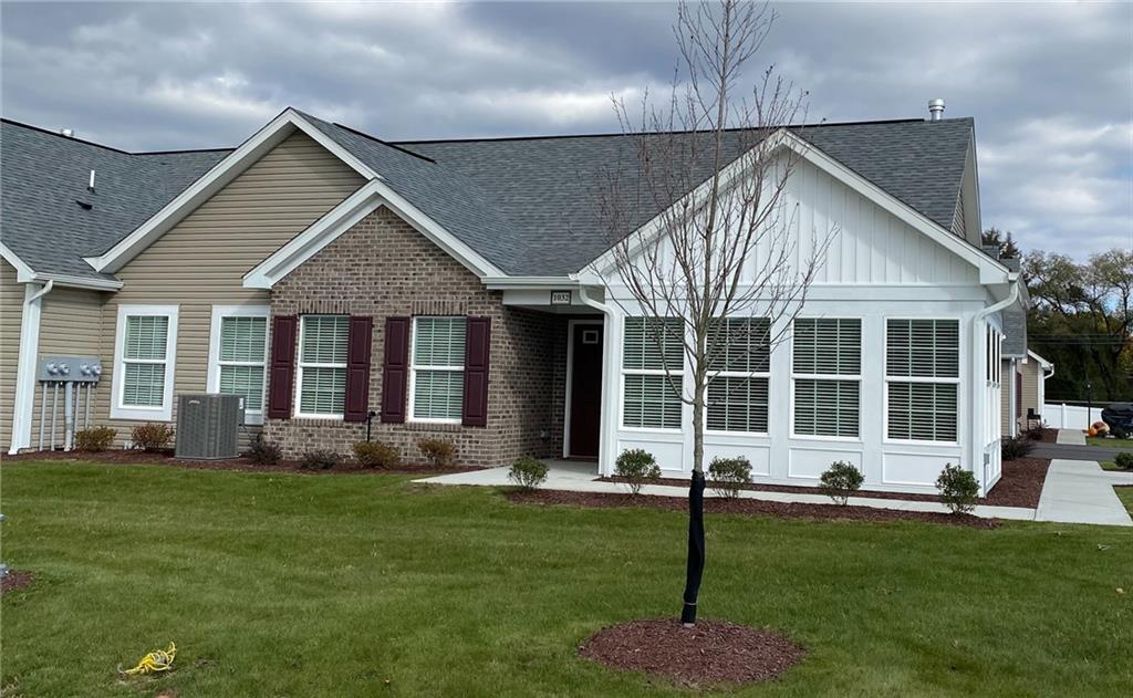 1214 Sandy Ridge Drive Sarver, PA 16055 - Photo 2 of 11 a front view of a house with a yard and porch