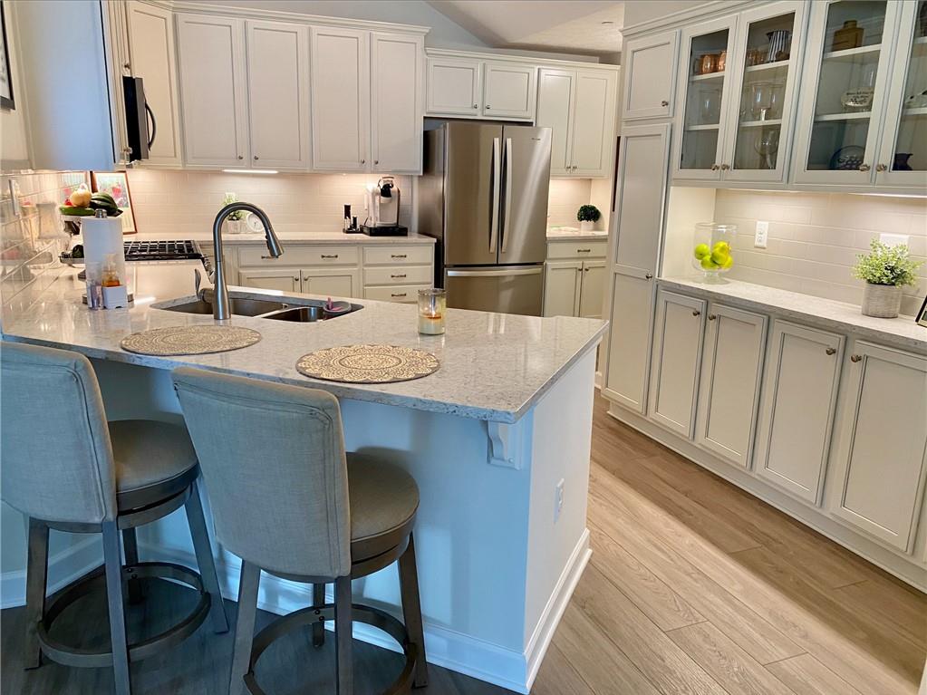 1214 Sandy Ridge Drive Sarver, PA 16055 - Photo 5 of 11 a kitchen with stainless steel appliances a sink a table and chairs