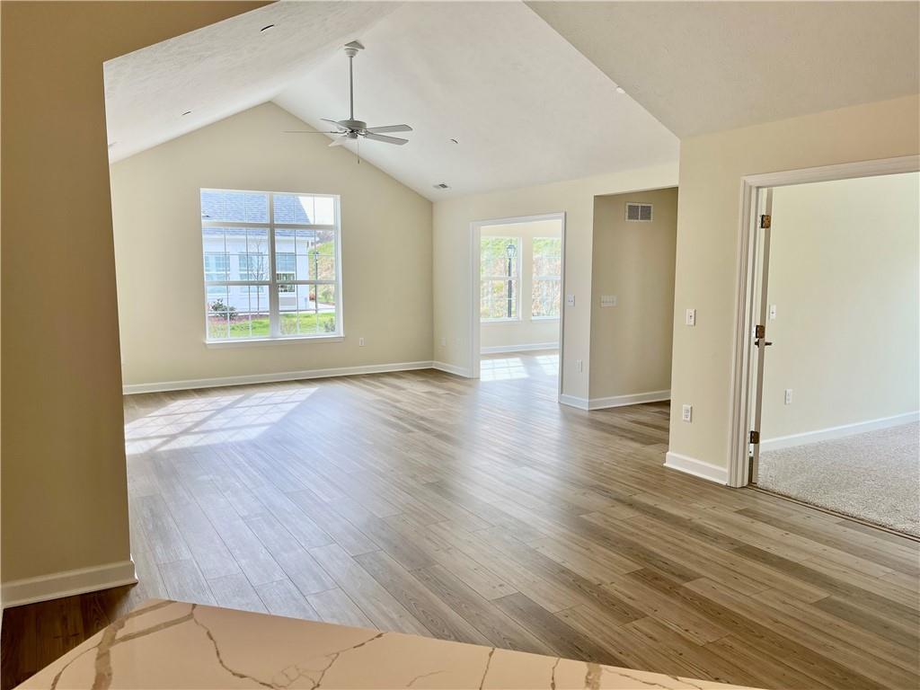 1214 Sandy Ridge Drive Sarver, PA 16055 - Photo 8 of 11 a view of an empty room with wooden floor and a window