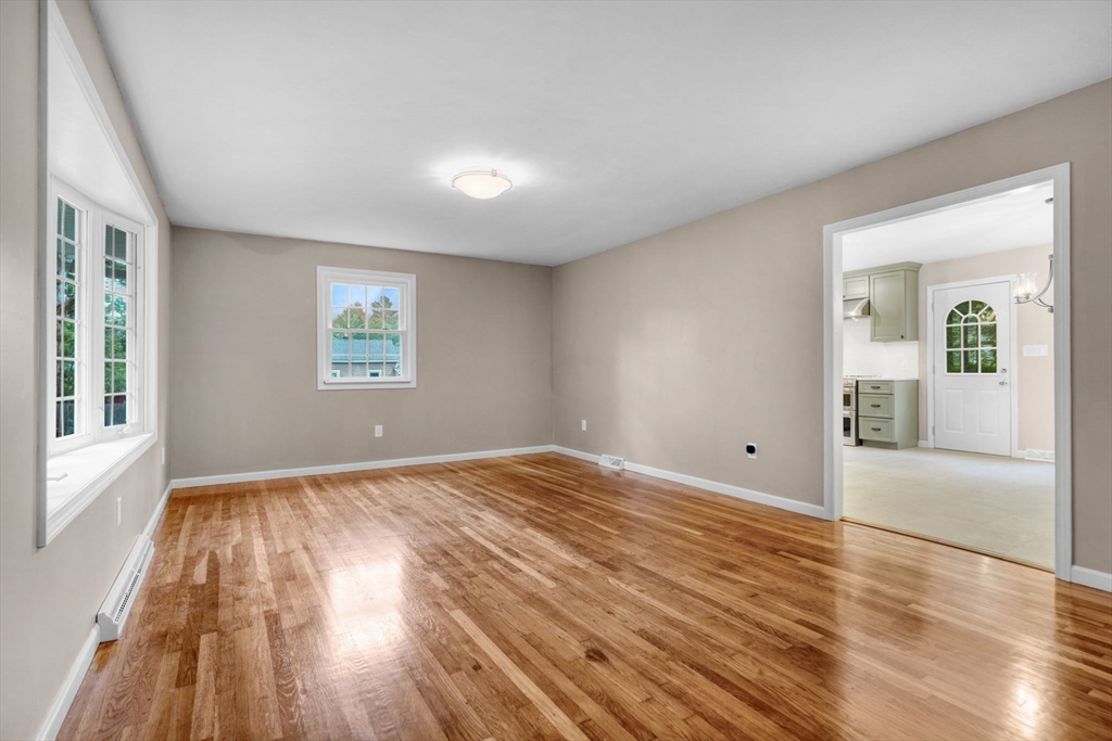 2 Woodland Road Acushnet, MA 02743 - Photo 12 of 26 a view of empty room with wooden floor and fan