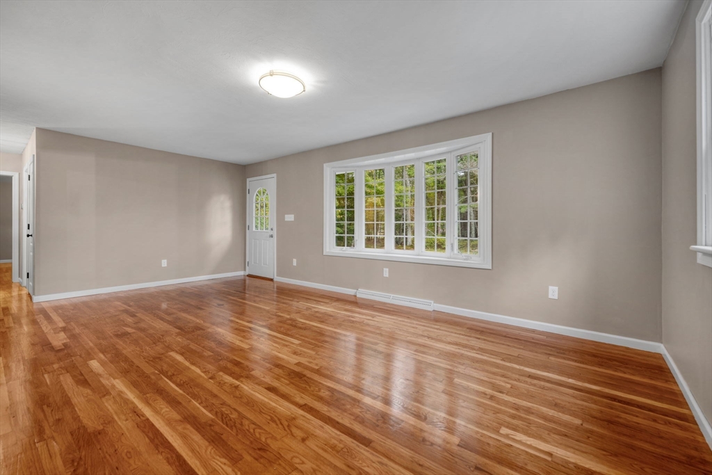 2 Woodland Road Acushnet, MA 02743 - Photo 13 of 26 a view of an empty room with wooden floor and a window
