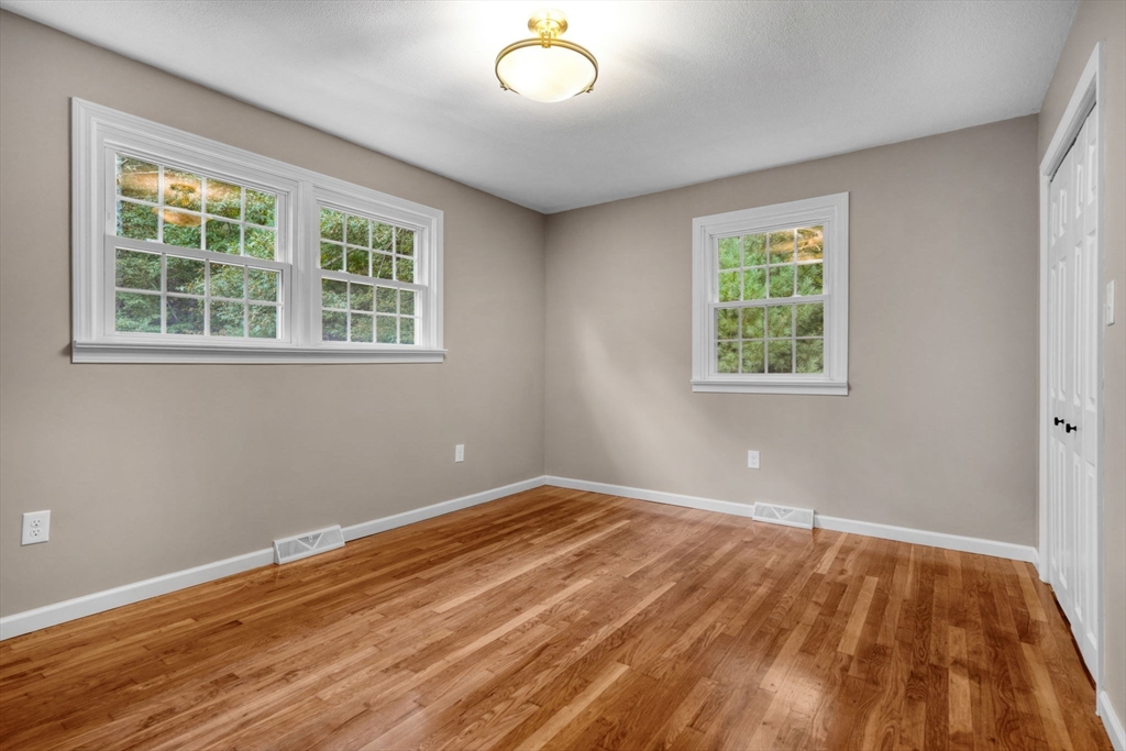 2 Woodland Road Acushnet, MA 02743 - Photo 14 of 26 an empty room with wooden floor and windows