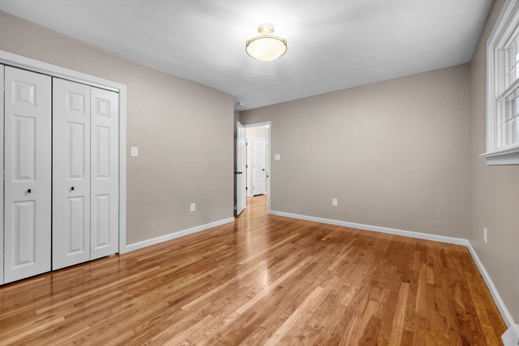 2 Woodland Road Acushnet, MA 02743 - Photo 15 of 26 a view of an empty room with wooden floor and a window