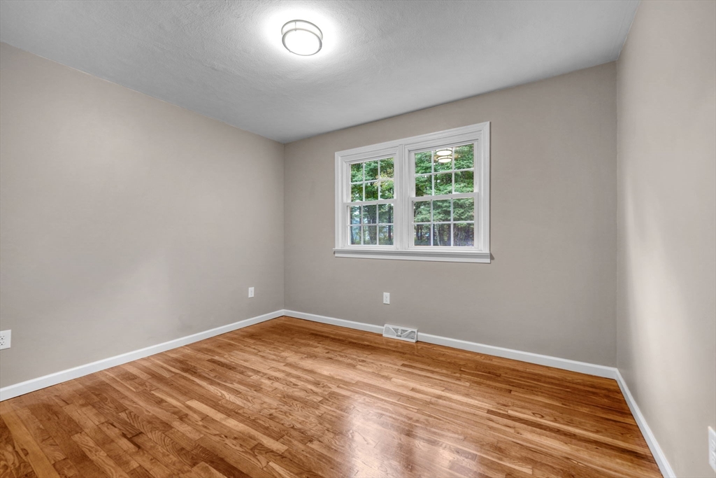 2 Woodland Road Acushnet, MA 02743 - Photo 16 of 26 a view of empty room with wooden floor