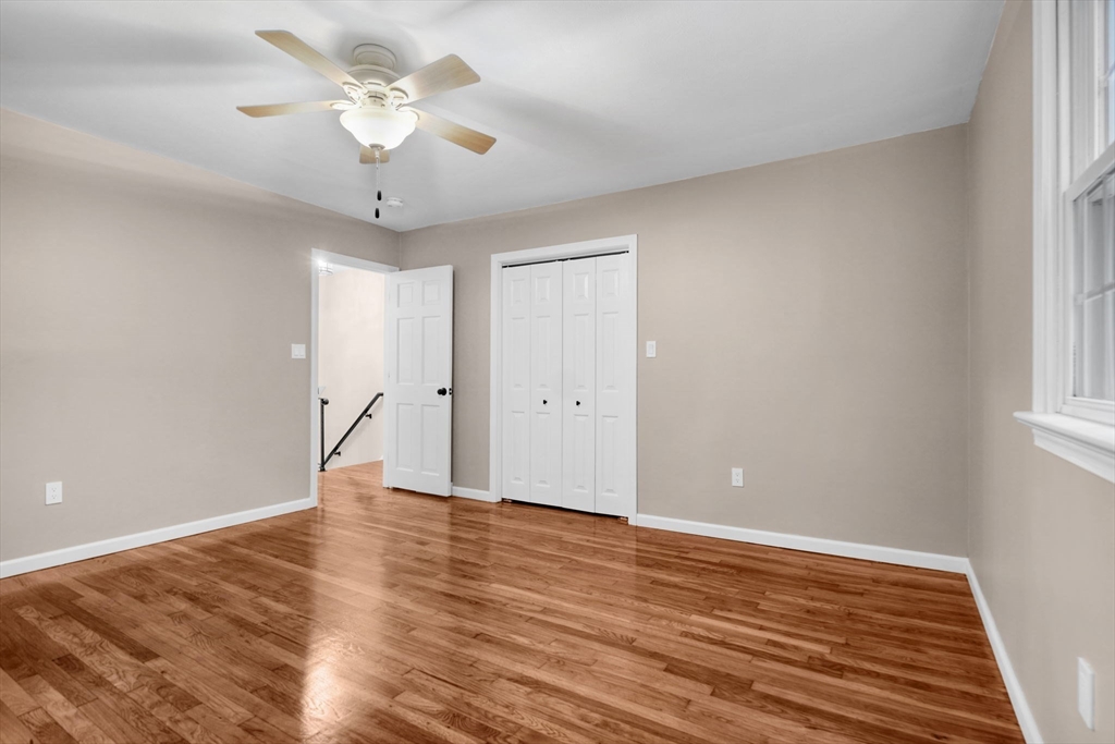 2 Woodland Road Acushnet, MA 02743 - Photo 17 of 26 wooden floor in an empty room with a window