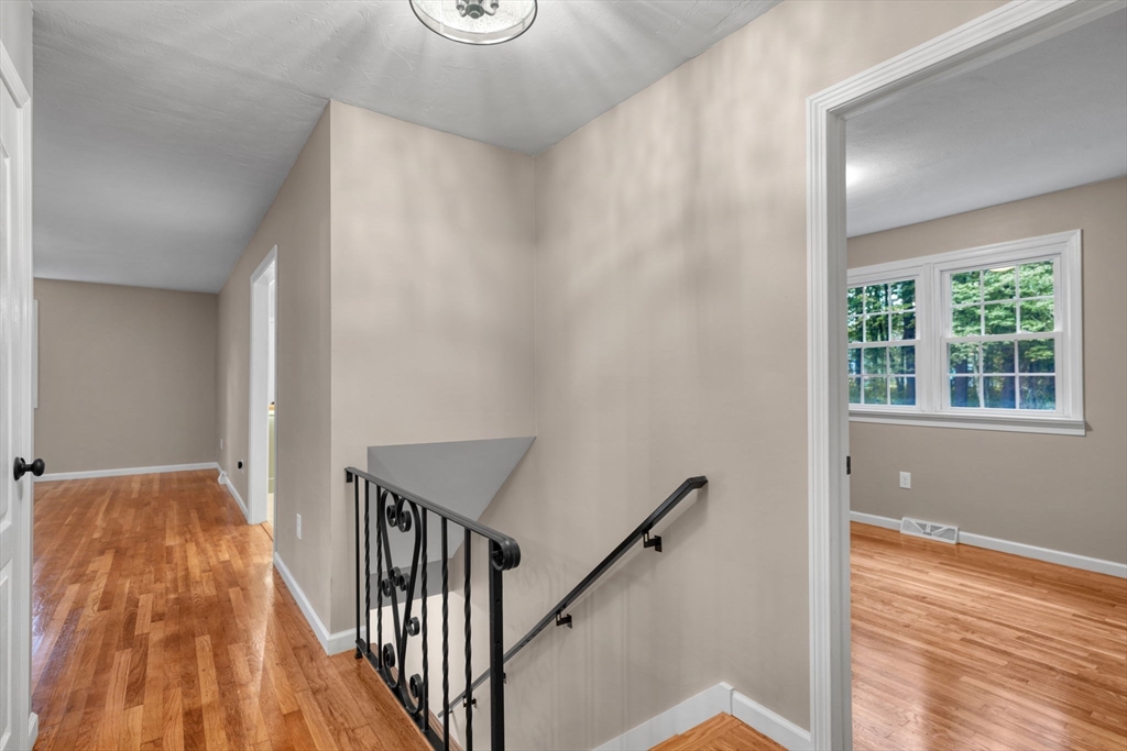 2 Woodland Road Acushnet, MA 02743 - Photo 19 of 26 a view of a room with wooden floor and stairs