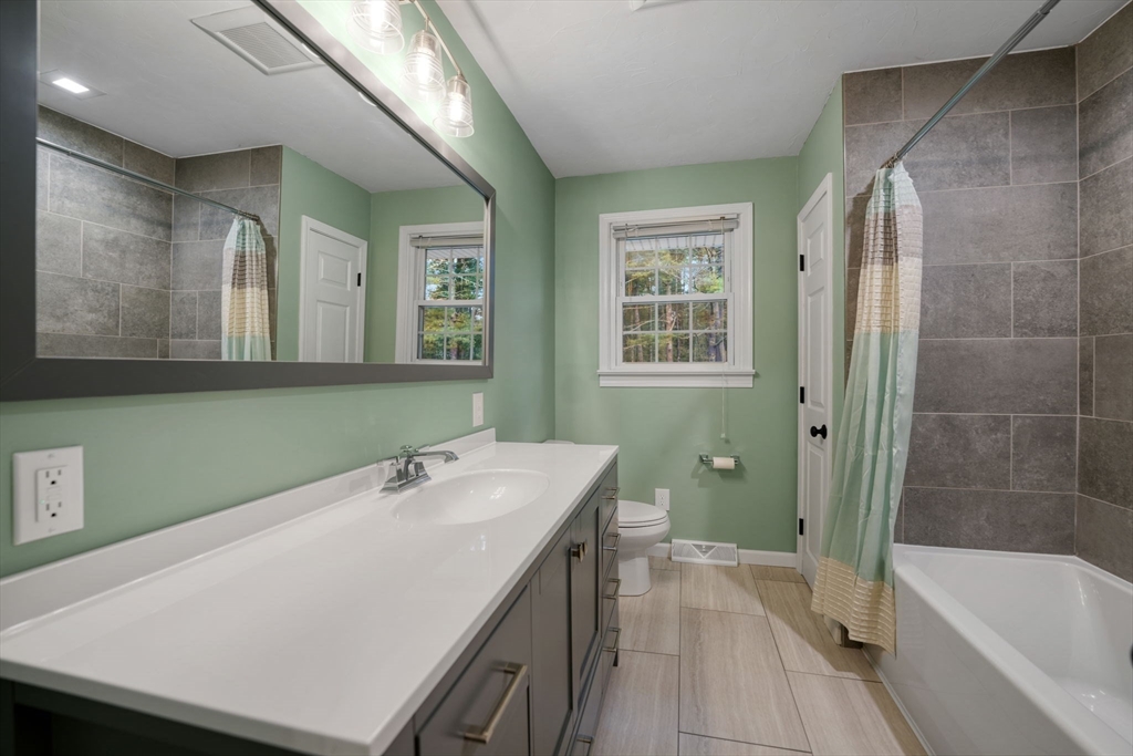2 Woodland Road Acushnet, MA 02743 - Photo 20 of 26 a bathroom with a sink a toilet and bathtub