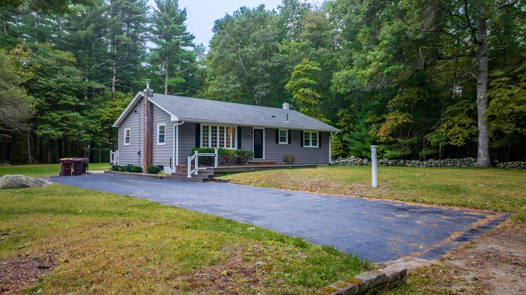 2 Woodland Road Acushnet, MA 02743 - Photo 2 of 26 a view of swimming pool with lawn chairs and large trees