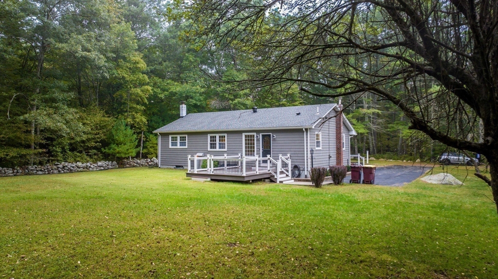 2 Woodland Road Acushnet, MA 02743 - Photo 22 of 26 a view of a house with a yard porch and sitting area
