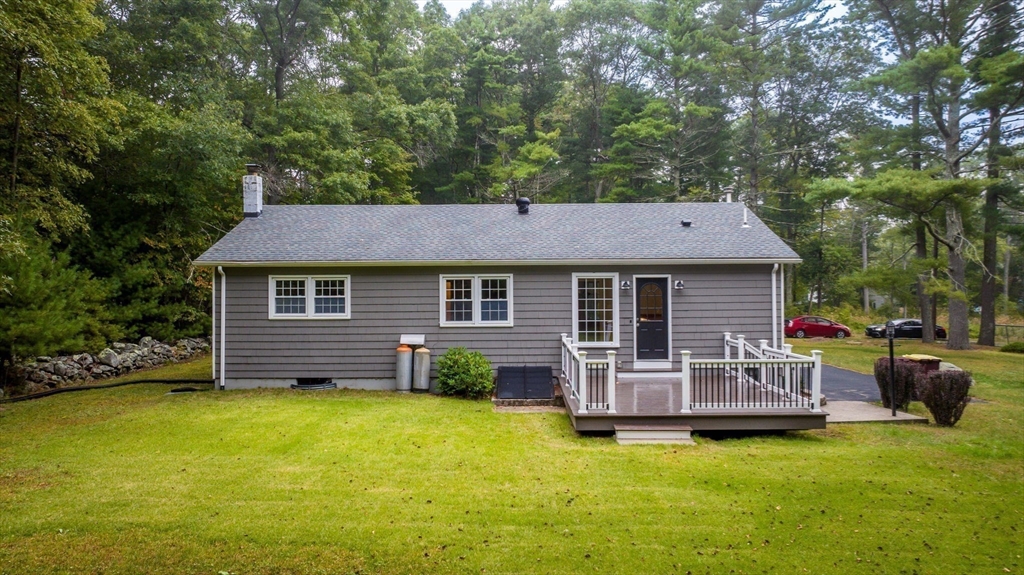 2 Woodland Road Acushnet, MA 02743 - Photo 23 of 26 a view of a house with a backyard and a patio