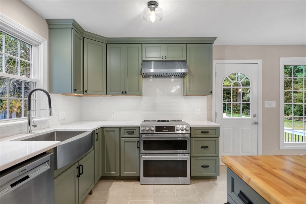 2 Woodland Road Acushnet, MA 02743 - Photo 7 of 26 a kitchen with a stove and a sink