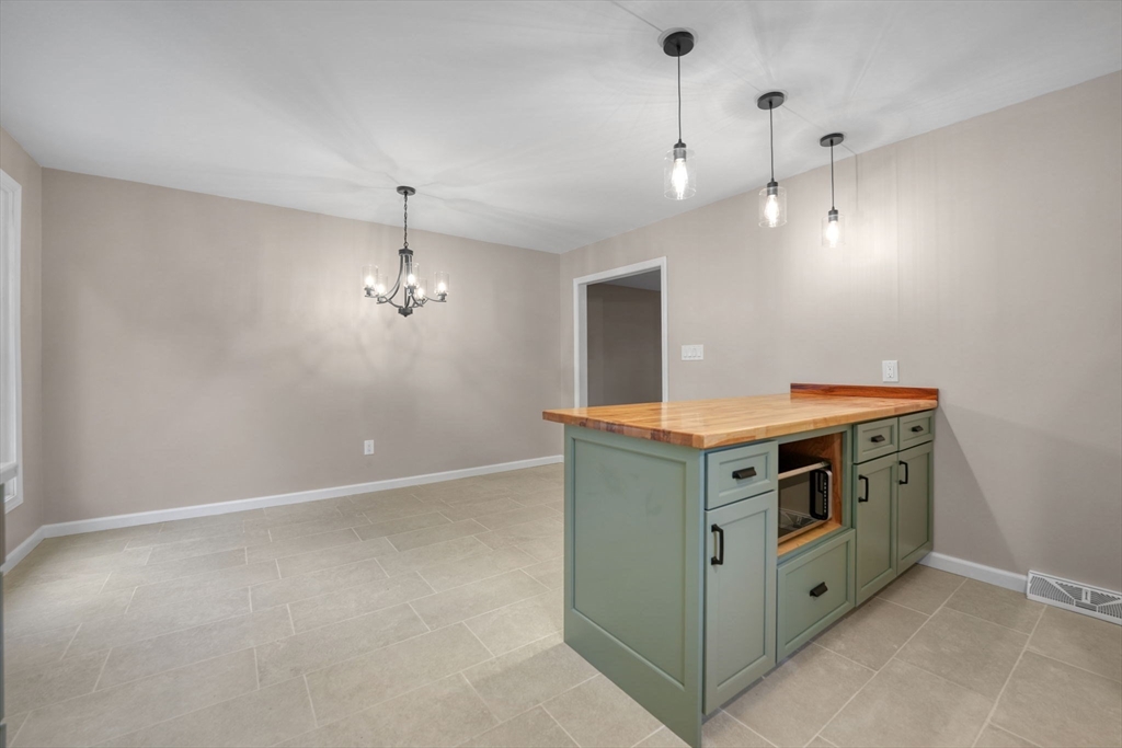 2 Woodland Road Acushnet, MA 02743 - Photo 9 of 26 a kitchen with a stove and a sink