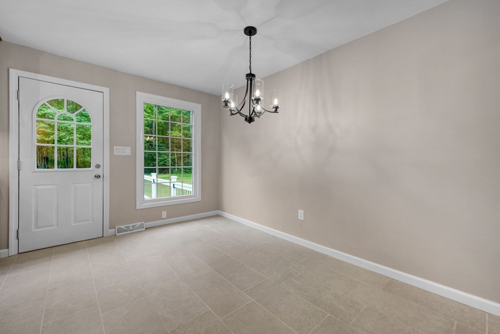 2 Woodland Road Acushnet, MA 02743 - Photo 10 of 26 an empty room with windows and entrance
