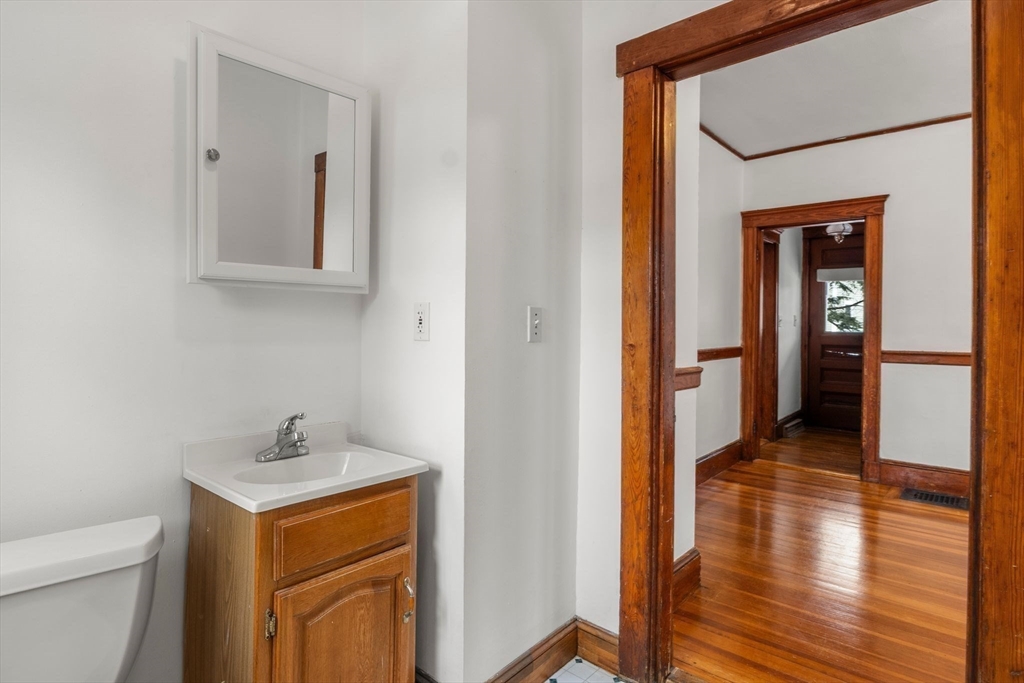 370 R Grove, Unit REAR Boston, MA 02132 - Photo 13 of 21 a view of hallway with sink and wooden floor