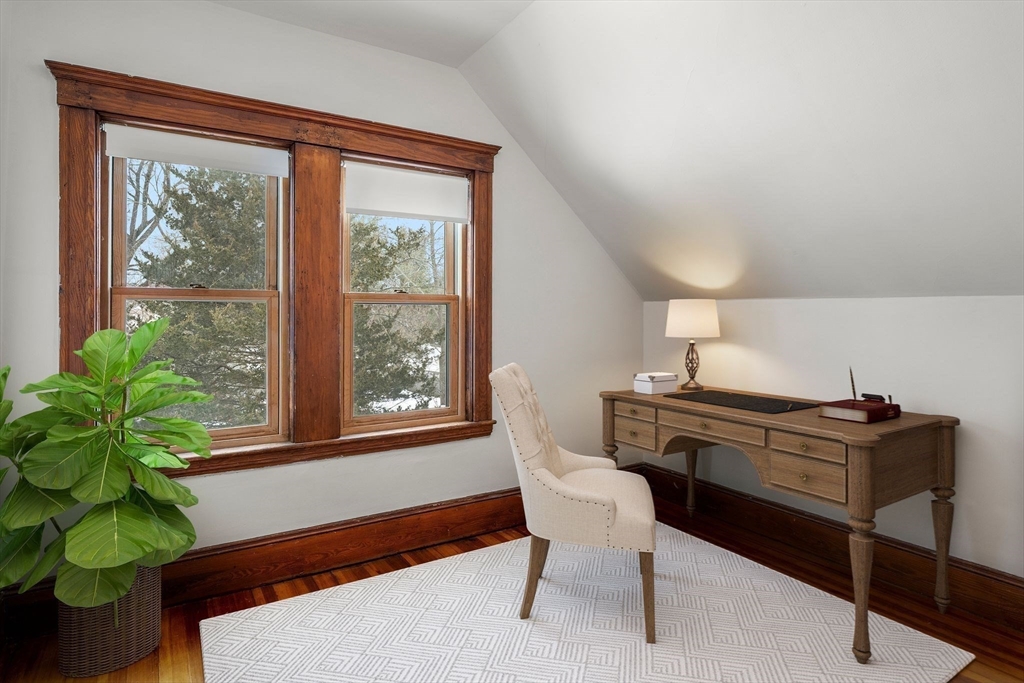 370 R Grove, Unit REAR Boston, MA 02132 - Photo 19 of 21 a living room with furniture and a potted plant