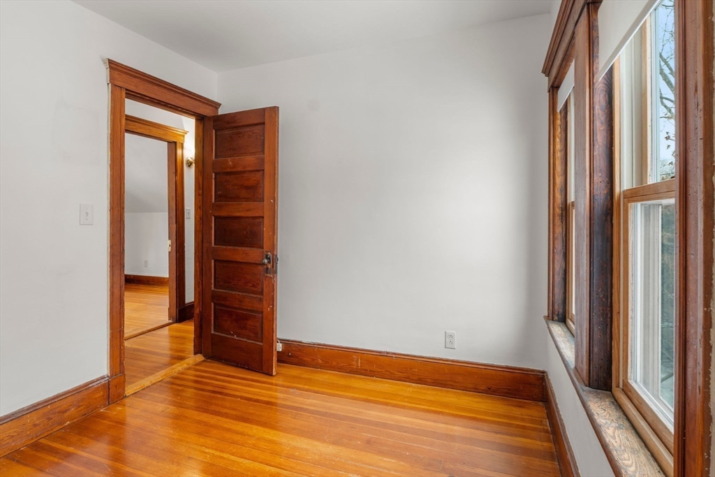 370 R Grove, Unit REAR Boston, MA 02132 - Photo 20 of 21 a view of wooden floor and closet in a room