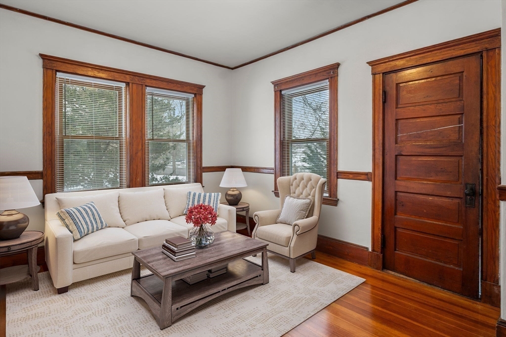 370 R Grove, Unit REAR Boston, MA 02132 - Photo 7 of 21 a living room with furniture and a window