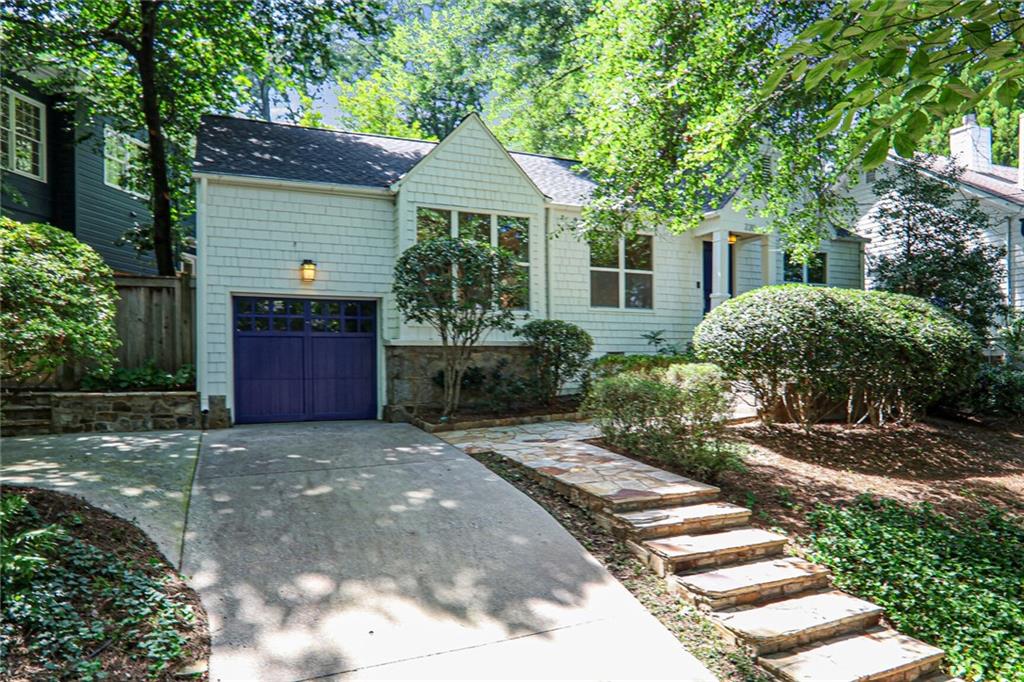 a front view of a house with garden
