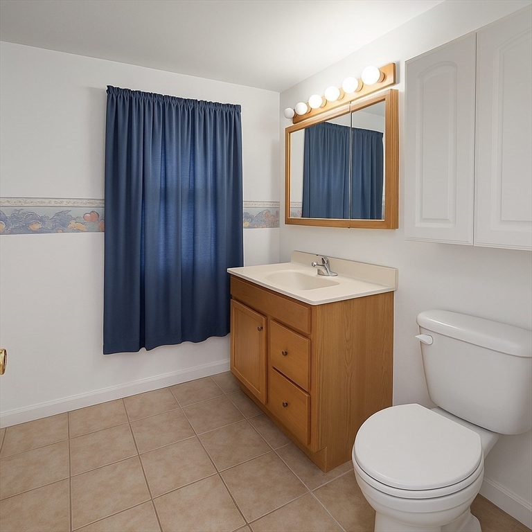 142 Morton Street West Springfield, MA 01089 - Photo 14 of 18 a bathroom with a sink a toilet and vanity