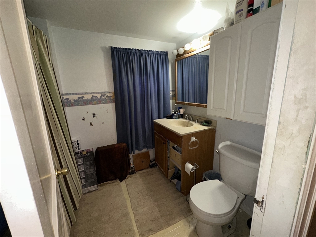 142 Morton Street West Springfield, MA 01089 - Photo 15 of 18 a bathroom with a sink toilet and shower