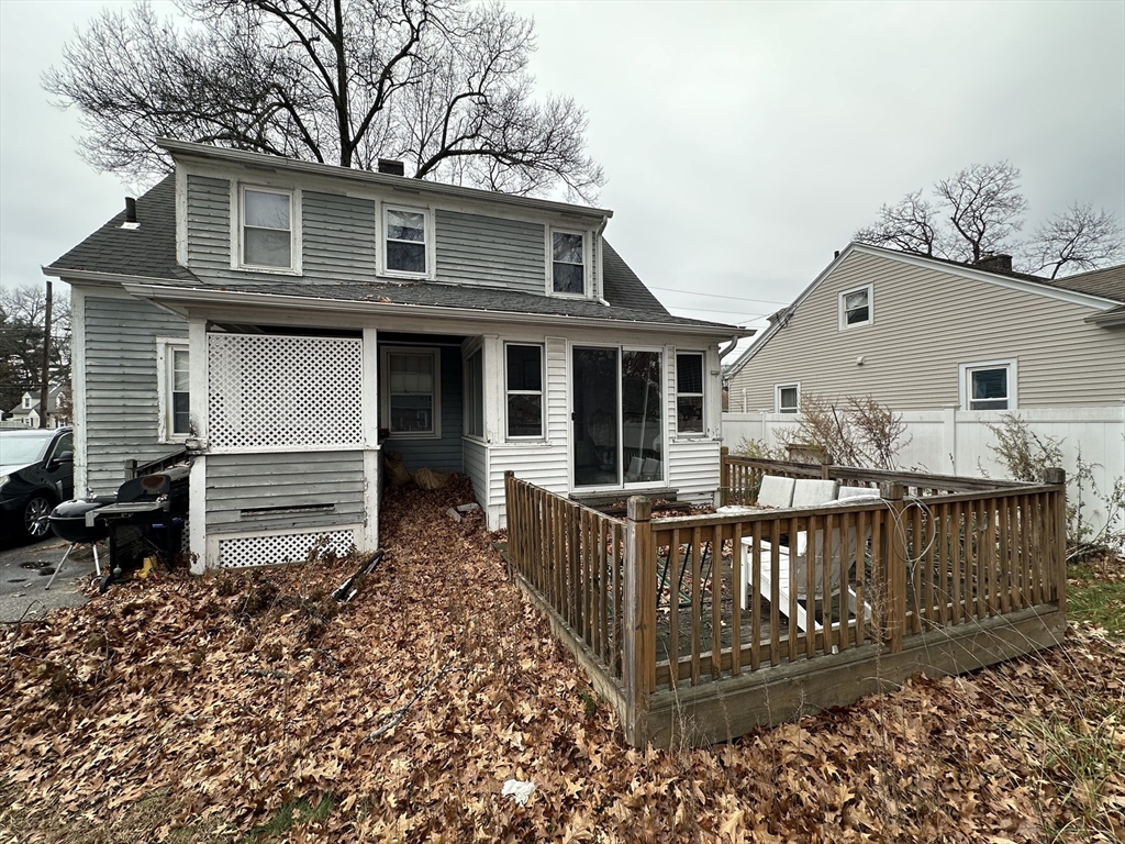 142 Morton Street West Springfield, MA 01089 - Photo 4 of 18 a view of a deck with wooden floor and fence