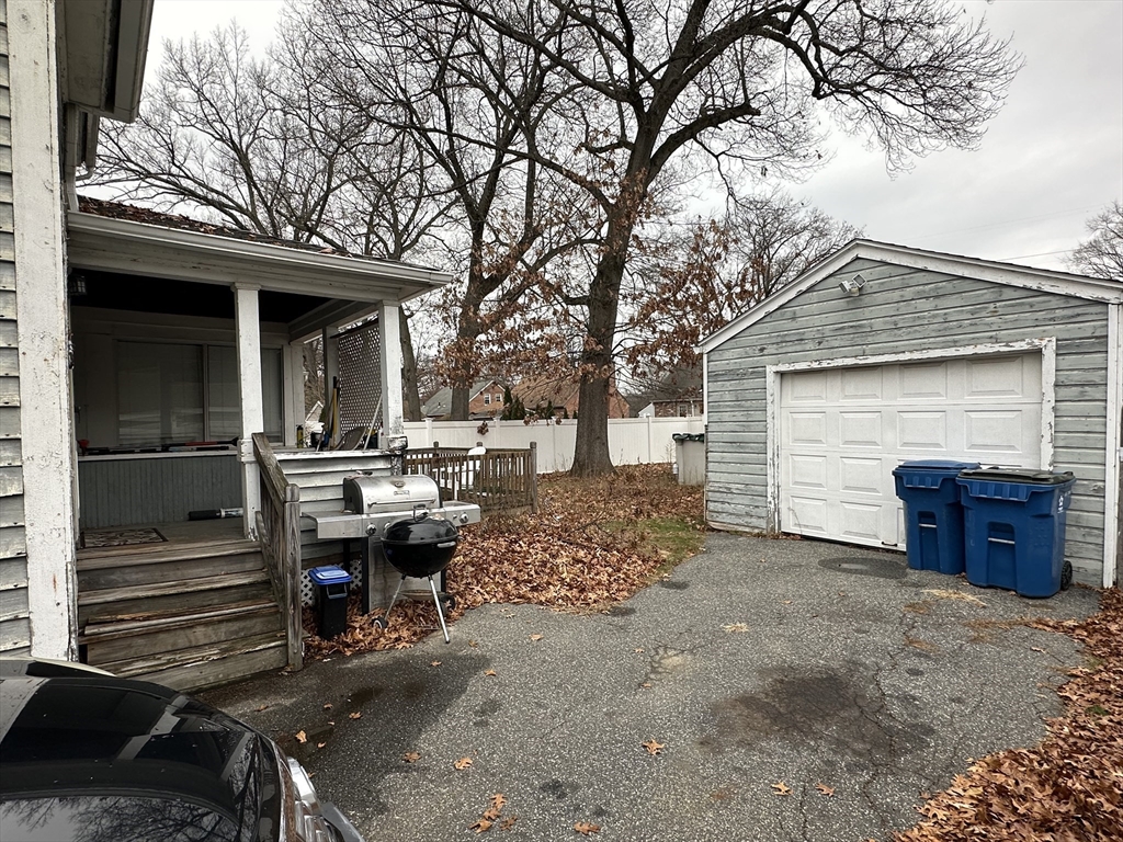 142 Morton Street West Springfield, MA 01089 - Photo 6 of 18 a view of a porch with furniture and a fire pit