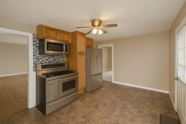 a kitchen with a stove and a microwave