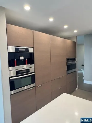 a kitchen with a refrigerator and stove