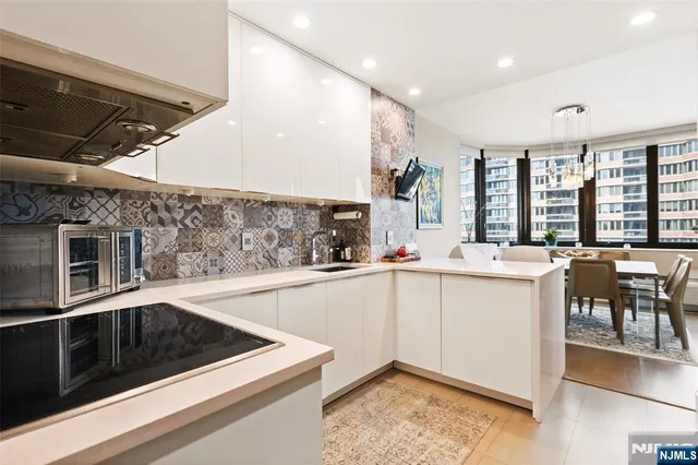 a kitchen with a sink and cabinets