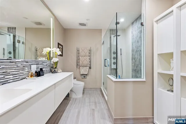 a bathroom with a double vanity sink and a mirror