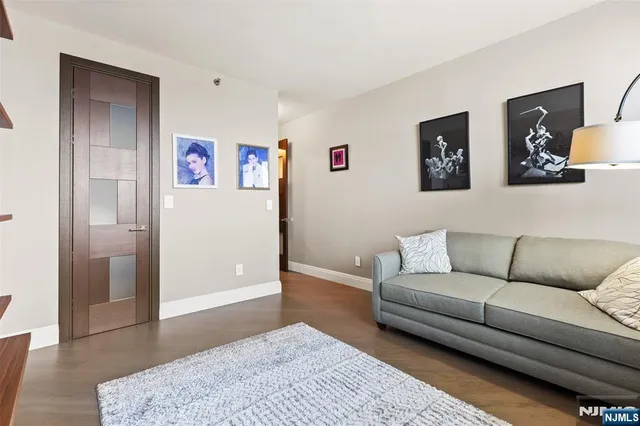 a living room with furniture and a rug