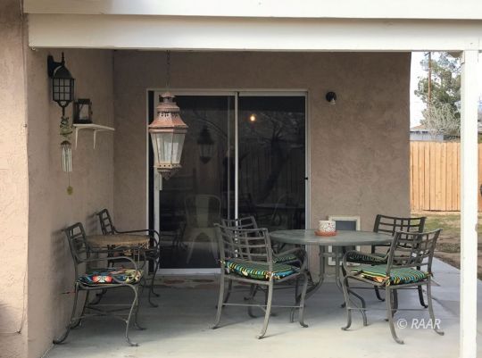 1237 West Iowa Avenue Ridgecrest, CA 93555 - Photo 20 of 20 a balcony with table and chairs