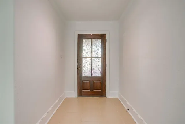 a view of an empty room and window