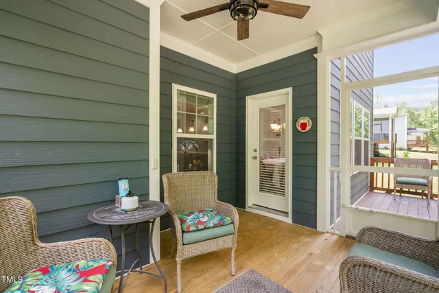a view of walk in closet with clothes