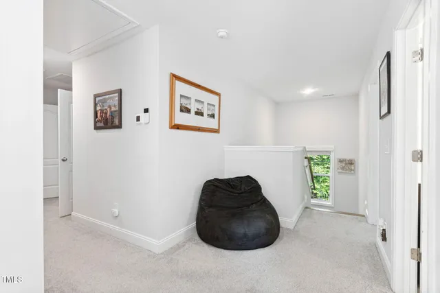 a bedroom with a bed and a book shelf