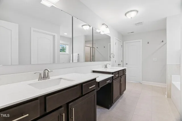 a front view of house with outdoor seating and barbeque oven