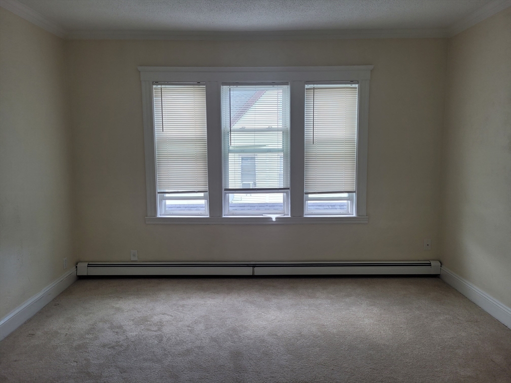 39 Irving Street, Unit 4 Everett, MA 02149 - Photo 5 of 8 an empty room with a window