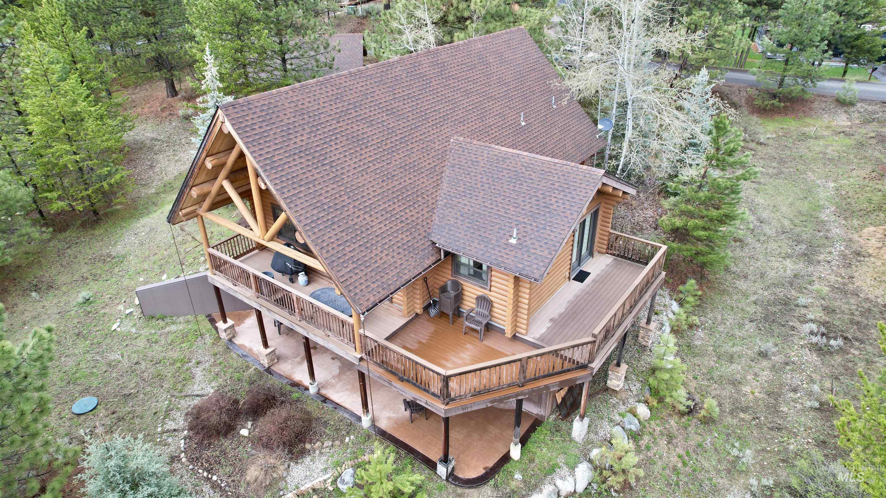 788 Chad Loop McCall, ID 83638 - Photo 3 of 22 Log-sided structure with multi-level wrap-around decking and a covered patio