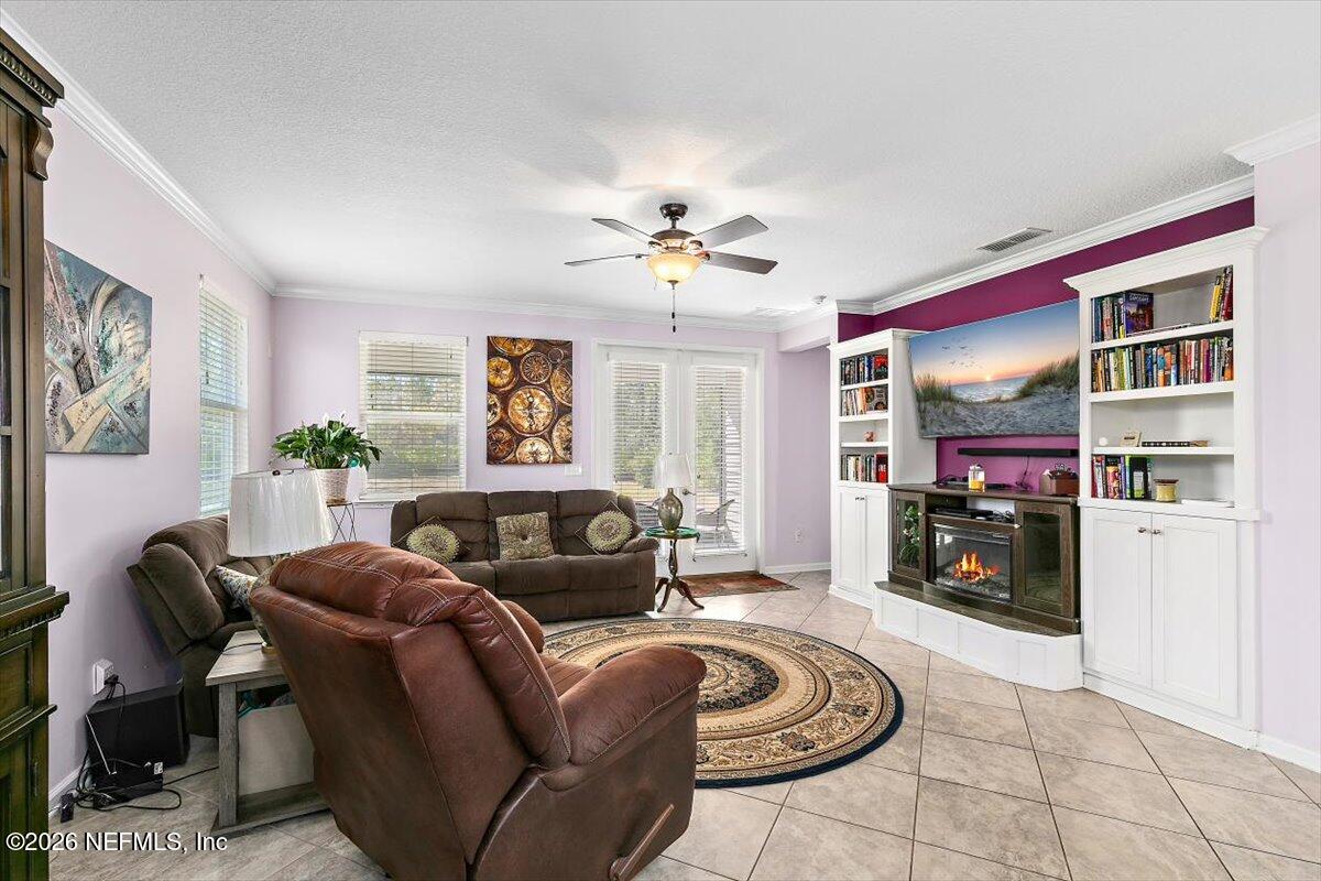 53 Monroe Avenue St. Augustine, FL 32086 - Photo 12 of 26 a living room with furniture and a fireplace
