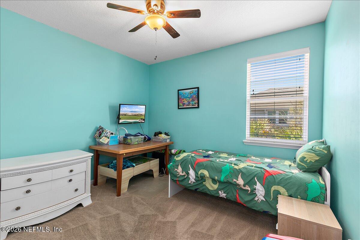53 Monroe Avenue St. Augustine, FL 32086 - Photo 18 of 26 a bedroom with a bed and a window