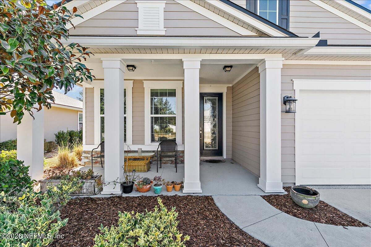 53 Monroe Avenue St. Augustine, FL 32086 - Photo 2 of 26 a front view of a house with a glass windows