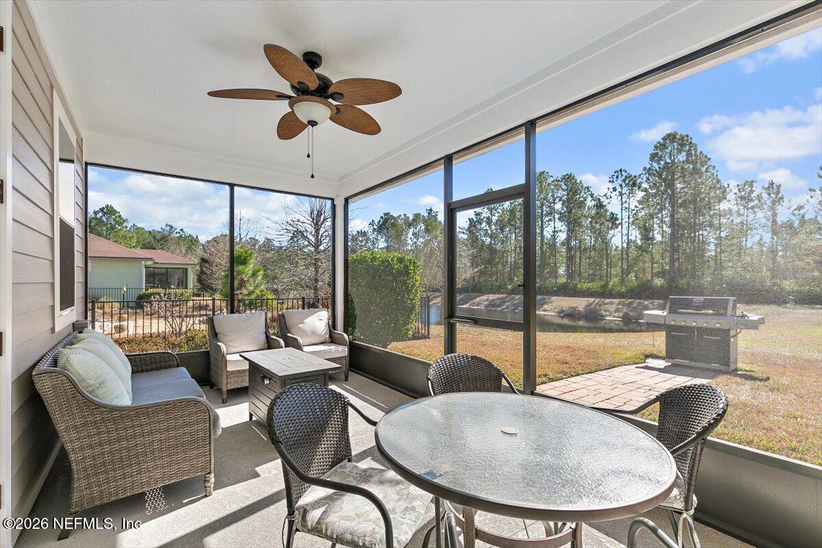 53 Monroe Avenue St. Augustine, FL 32086 - Photo 22 of 26 a living room with furniture and a large window